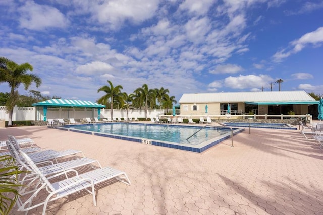 18460 SE Wood Haven Ln Unit D, Jupiter, FL 33469 - community pool featuring fence and a patio area