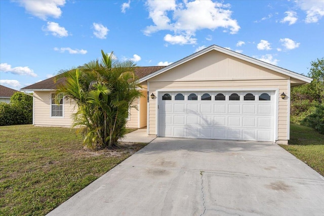 ranch-style house with a garage and a front yard