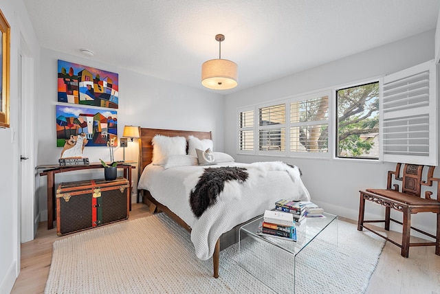 bedroom with wood-type flooring