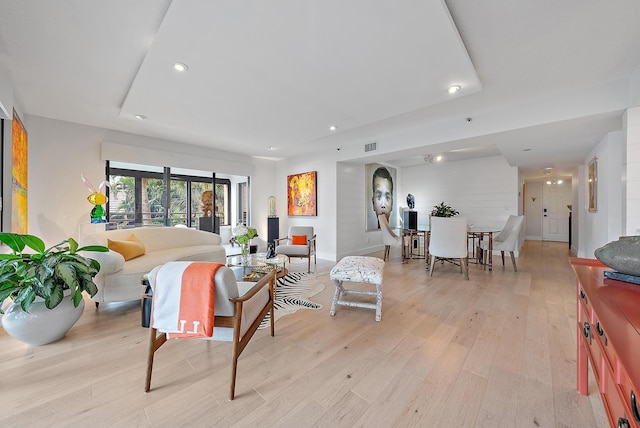 living room with light hardwood / wood-style flooring