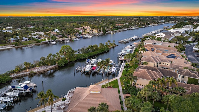 aerial view at dusk with a water view