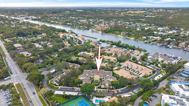 birds eye view of property with a water view