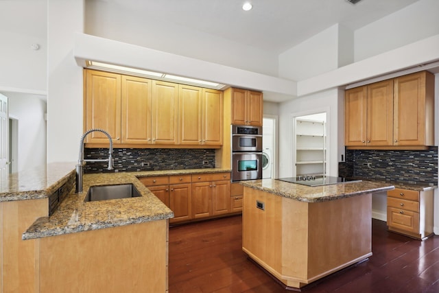 kitchen with kitchen peninsula, double oven, dark hardwood / wood-style flooring, black electric cooktop, and sink