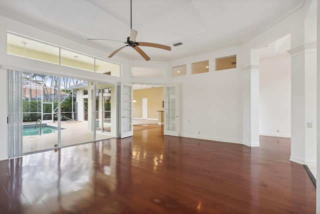 unfurnished room with dark wood-type flooring, french doors, ceiling fan, and ornamental molding