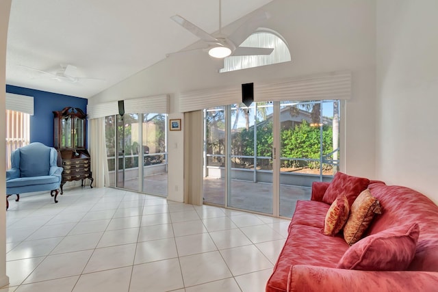 living room with ceiling fan, high vaulted ceiling, and light tile patterned flooring