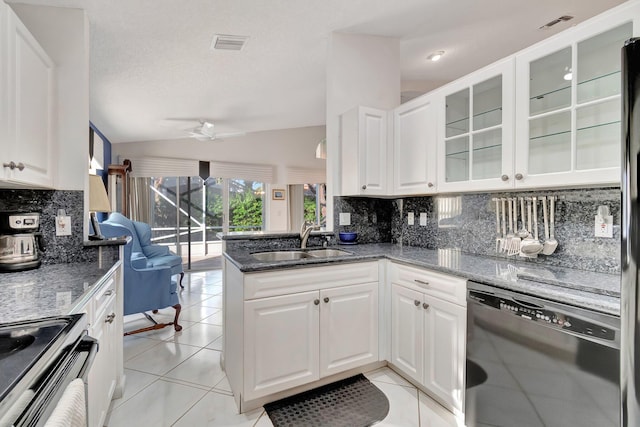 kitchen with sink, white cabinetry, black dishwasher, and kitchen peninsula