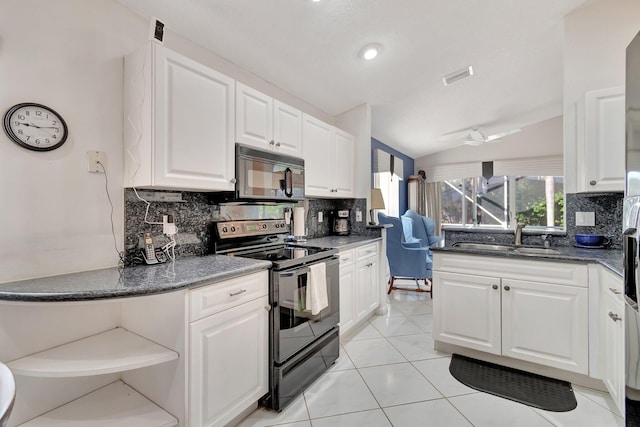 kitchen with lofted ceiling, white cabinets, sink, and black appliances