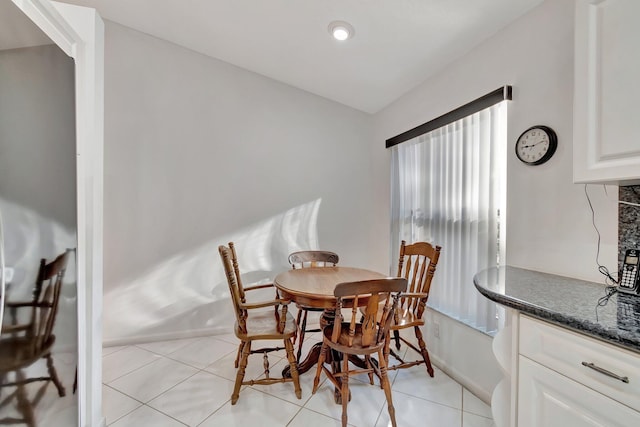 dining area with light tile patterned floors