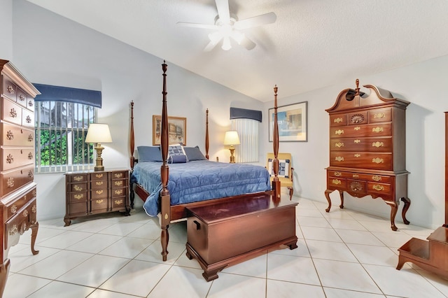 bedroom with light tile patterned floors, ceiling fan, and vaulted ceiling