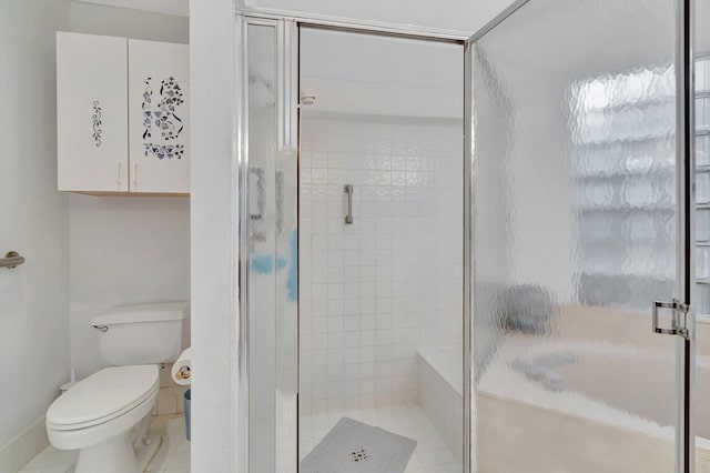 bathroom with toilet, walk in shower, and tile patterned floors