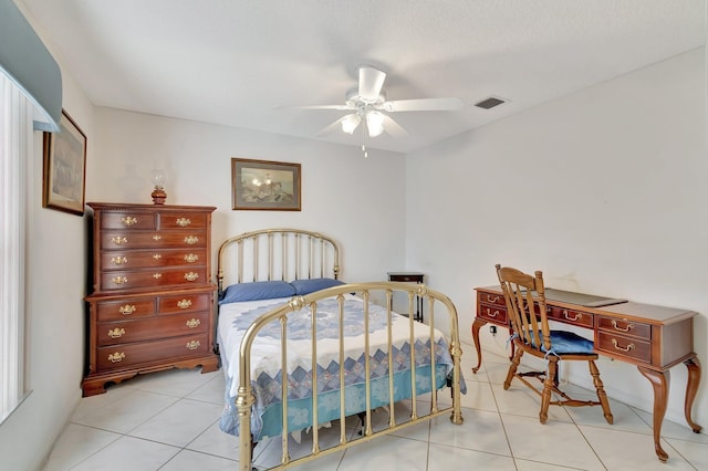 bedroom with ceiling fan and light tile patterned floors