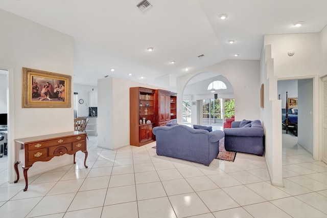 tiled living room with vaulted ceiling