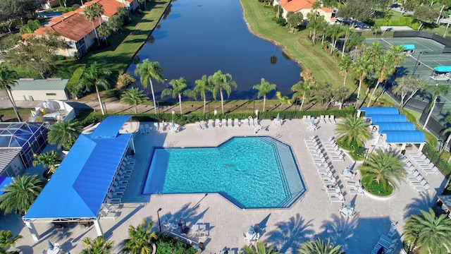 birds eye view of property with a water view