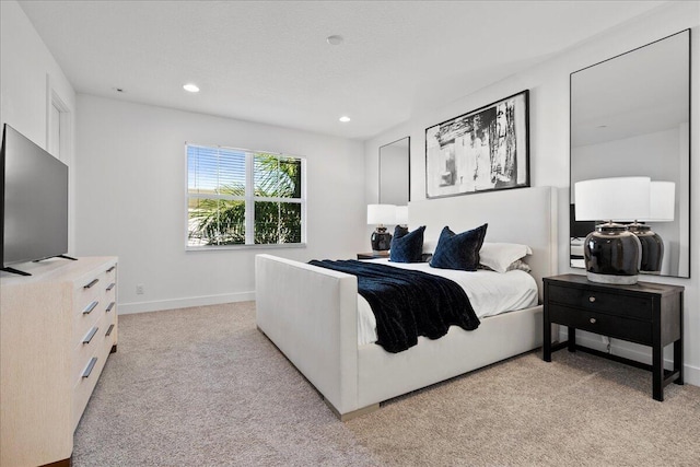 bedroom featuring light carpet