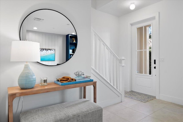 entryway featuring light tile patterned floors