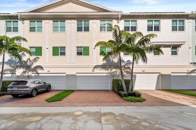 multi unit property featuring a garage