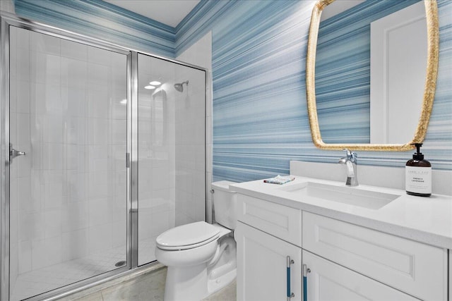 bathroom with toilet, tile patterned flooring, a shower with shower door, and vanity