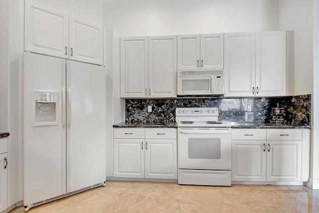 kitchen with white appliances, white cabinetry, dark stone countertops, and backsplash