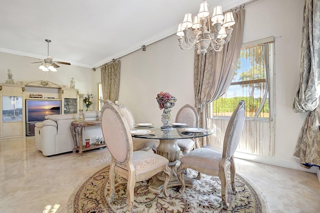 dining room with ceiling fan with notable chandelier and ornamental molding