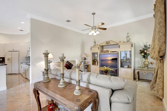 living room featuring ceiling fan and ornamental molding