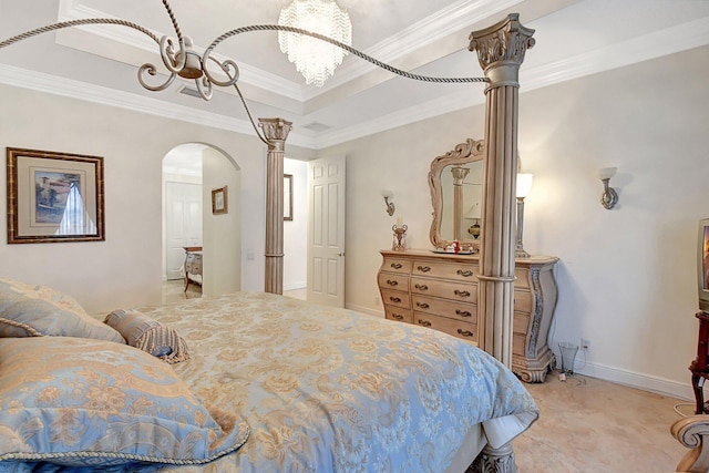 bedroom with an inviting chandelier, ornamental molding, and a tray ceiling