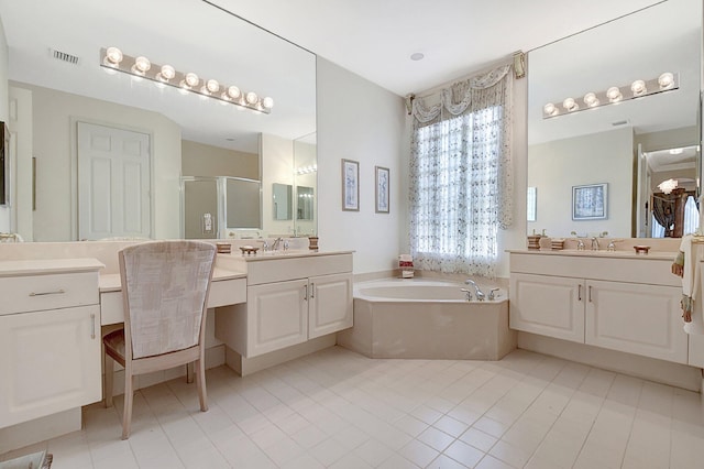 bathroom with tile patterned flooring, vanity, and shower with separate bathtub