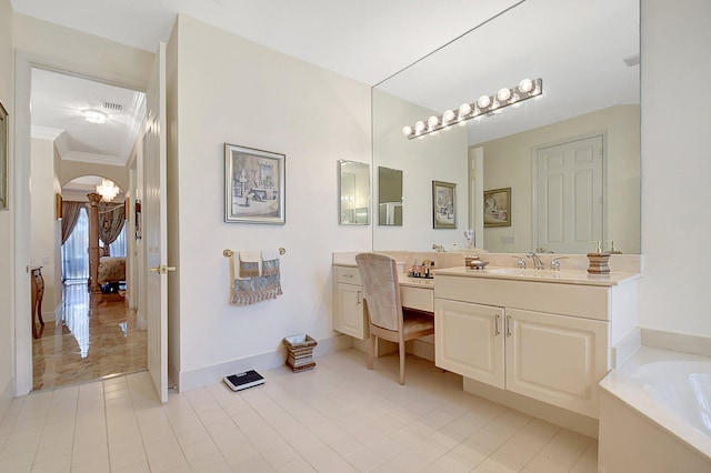 bathroom with a bathing tub, ornamental molding, tile patterned floors, and vanity