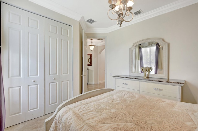 bedroom featuring an inviting chandelier, a closet, and crown molding