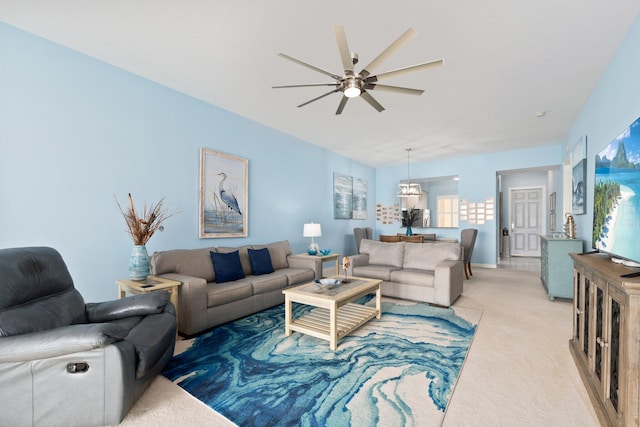 living room with light colored carpet and ceiling fan