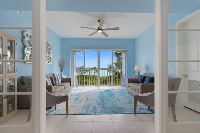 tiled living area featuring ceiling fan