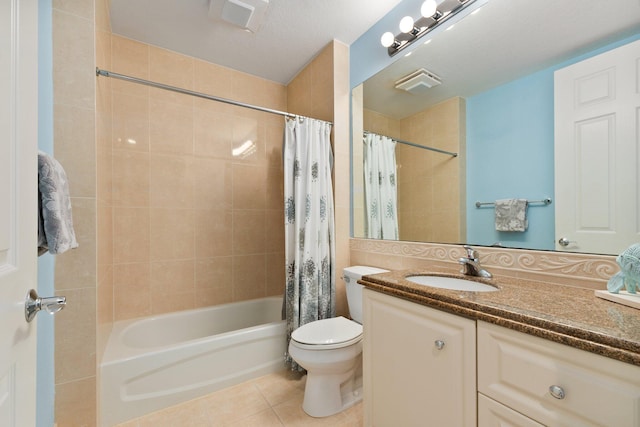 full bath featuring shower / tub combo, vanity, toilet, and tile patterned floors