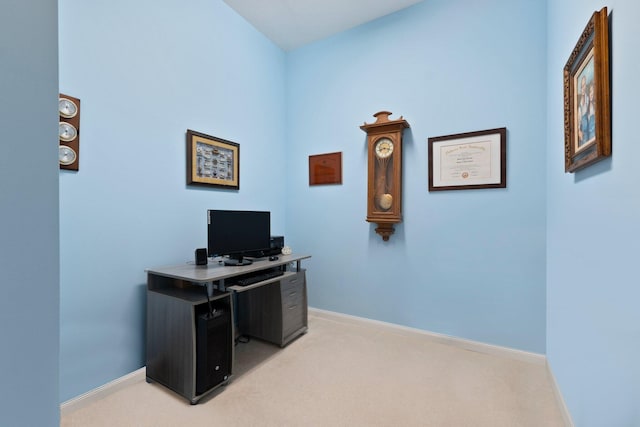 office featuring baseboards and light colored carpet