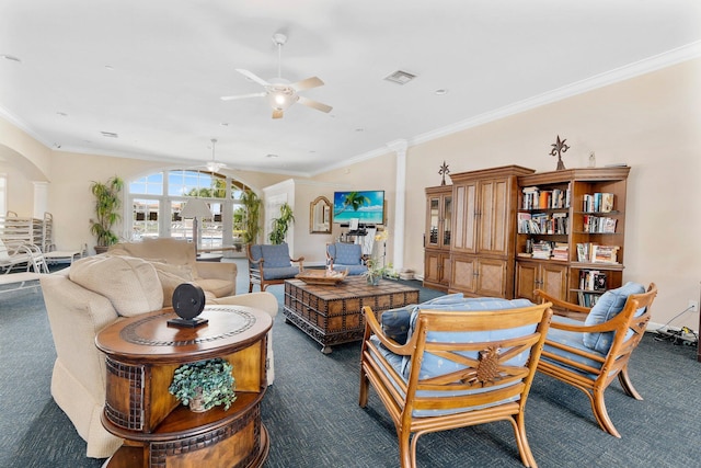 living area with ornamental molding, dark colored carpet, visible vents, and ceiling fan