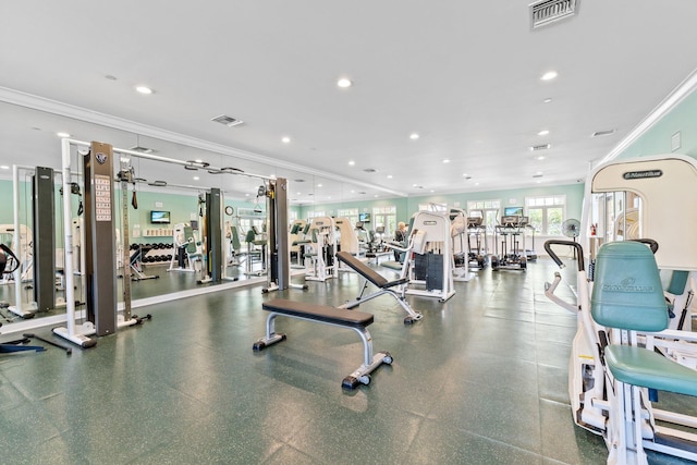 workout area with visible vents, crown molding, and recessed lighting