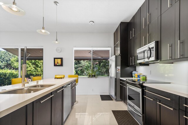 kitchen featuring light tile patterned flooring and appliances with stainless steel finishes