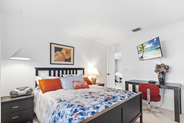 bedroom featuring light tile patterned flooring