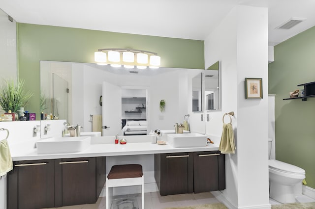 bathroom with vanity, walk in shower, and toilet