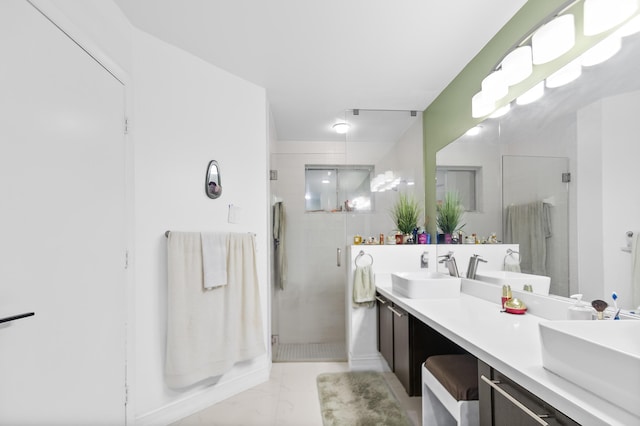 bathroom featuring vanity and a shower with shower door