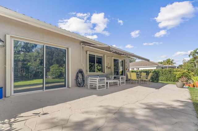 rear view of house with a yard and a patio area