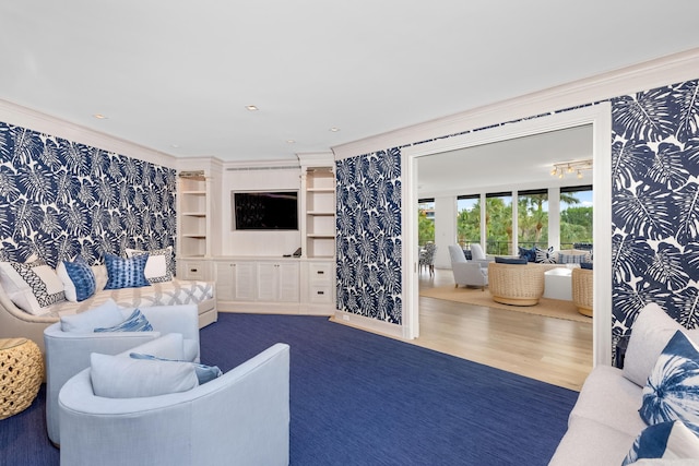 living room with crown molding and hardwood / wood-style flooring