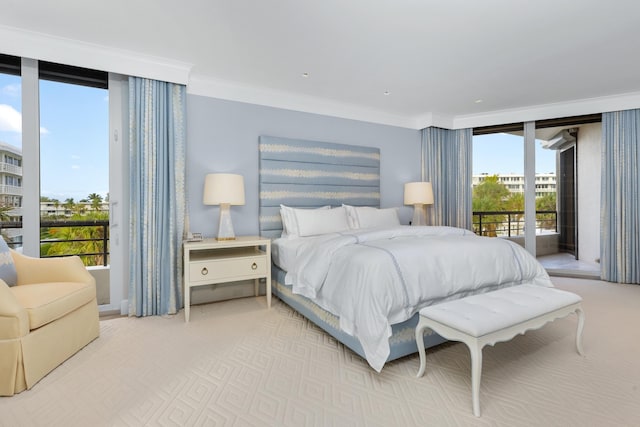 bedroom with access to exterior, crown molding, and light colored carpet