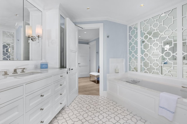 bathroom featuring vanity and crown molding