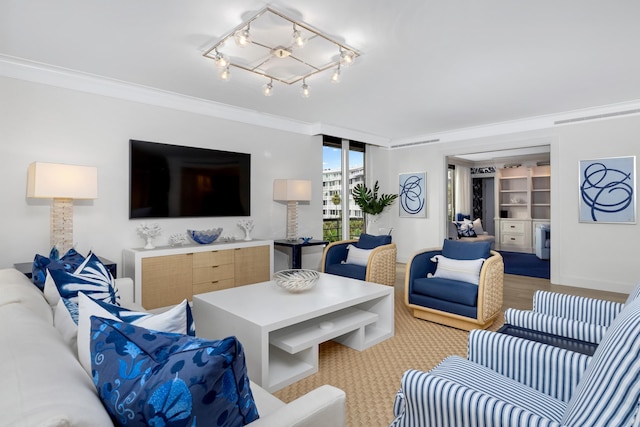 living room featuring an inviting chandelier, ornamental molding, and expansive windows