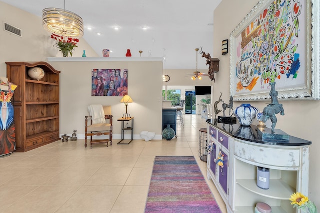 foyer with ceiling fan and light tile patterned floors