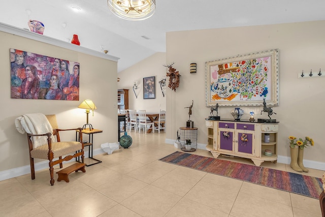 interior space featuring vaulted ceiling and light tile patterned flooring