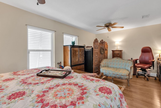 bedroom featuring ceiling fan and light hardwood / wood-style floors