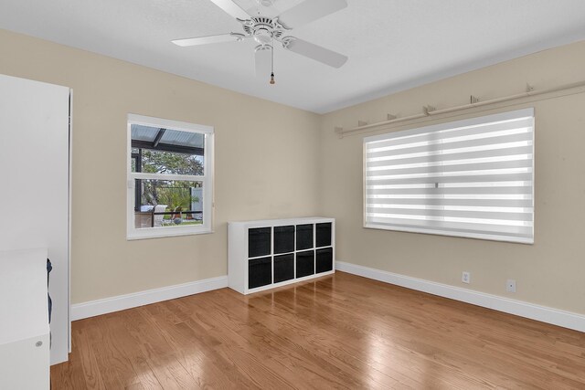 empty room featuring ceiling fan and light wood-type flooring