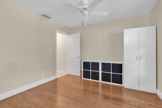 unfurnished bedroom featuring ceiling fan and wood-type flooring