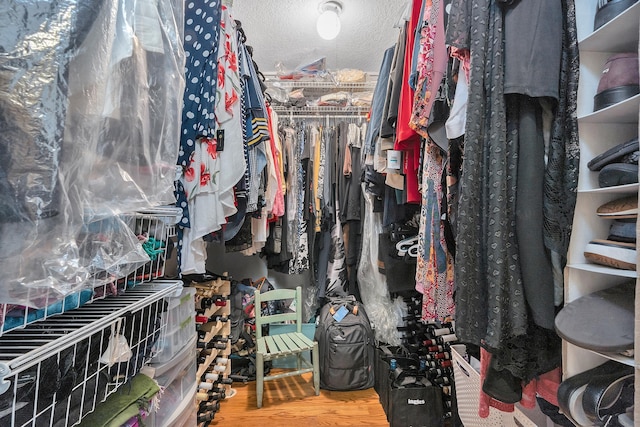 walk in closet featuring wood-type flooring