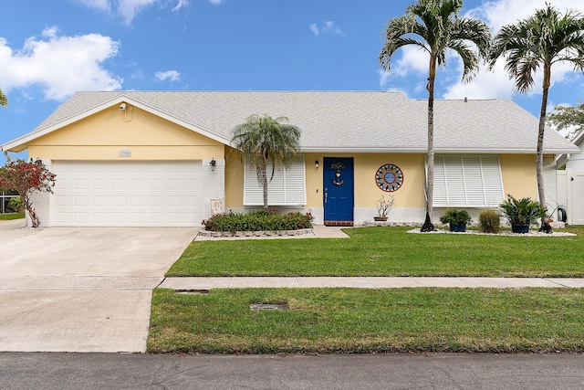 single story home with a garage and a front yard